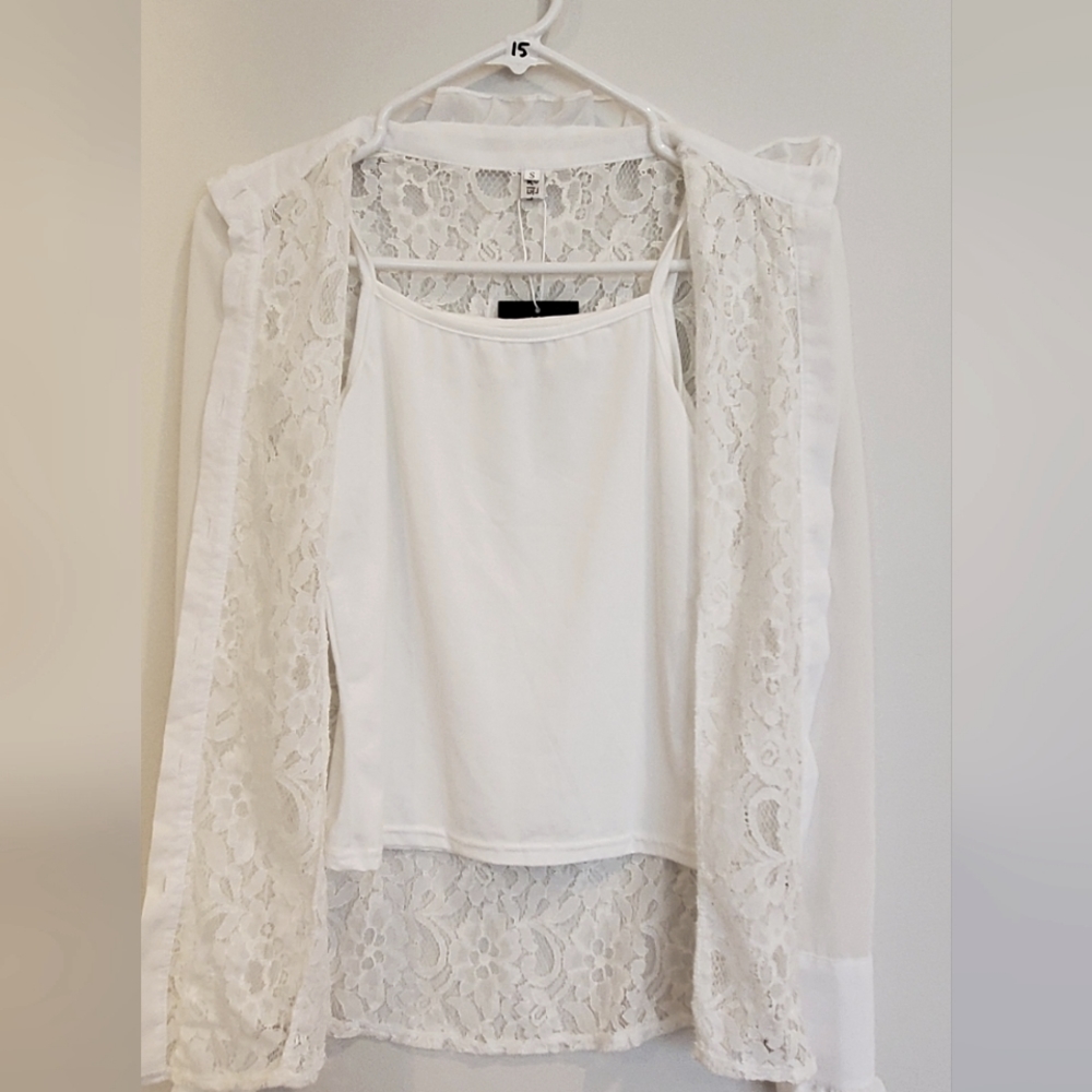 white woman's blouse with gold buttons